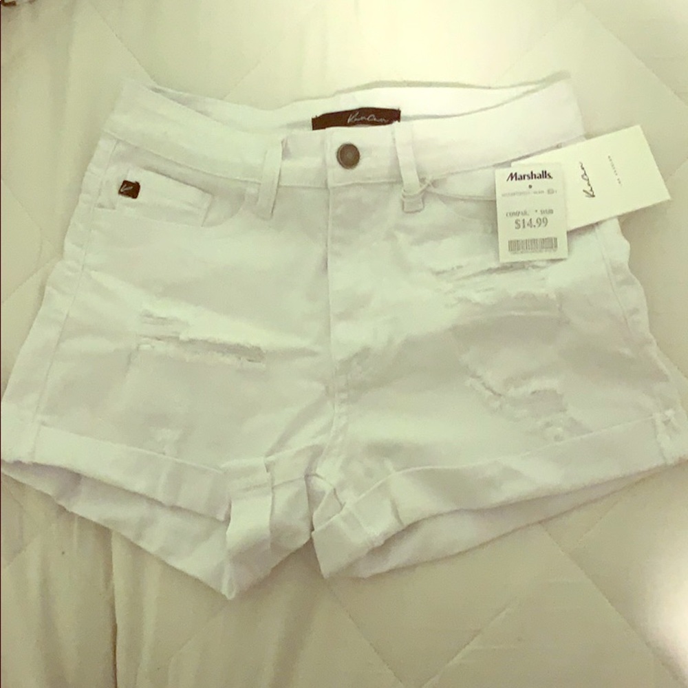 Mid waisted, ripped white shorts